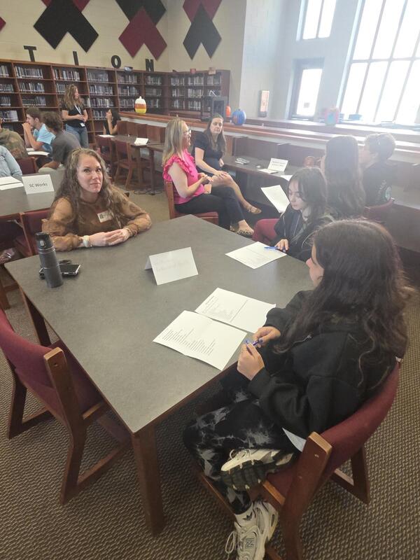 Students talking to a career professional about their career path at the Fall 2026 Human Library