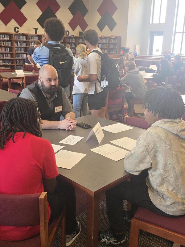 Students talking to a career professional about their career path at the Fall 2026 Human Library
