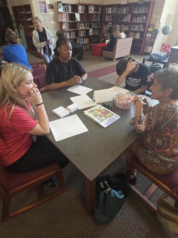 Students talking to a career professional about their career path at the Fall 2026 Human Library