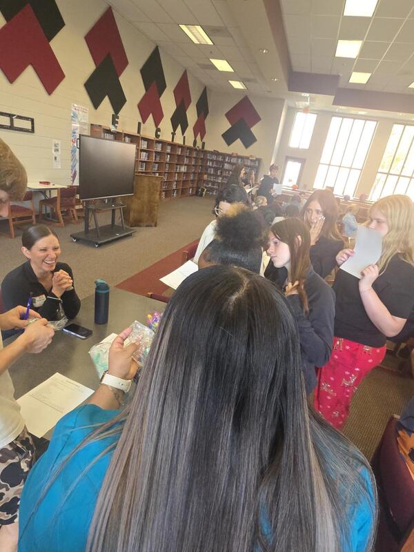 Students talking to a career professional about their career path at the Fall 2026 Human Library