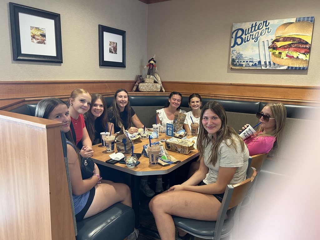 A group of high school girls sitting around a table at Culvers.