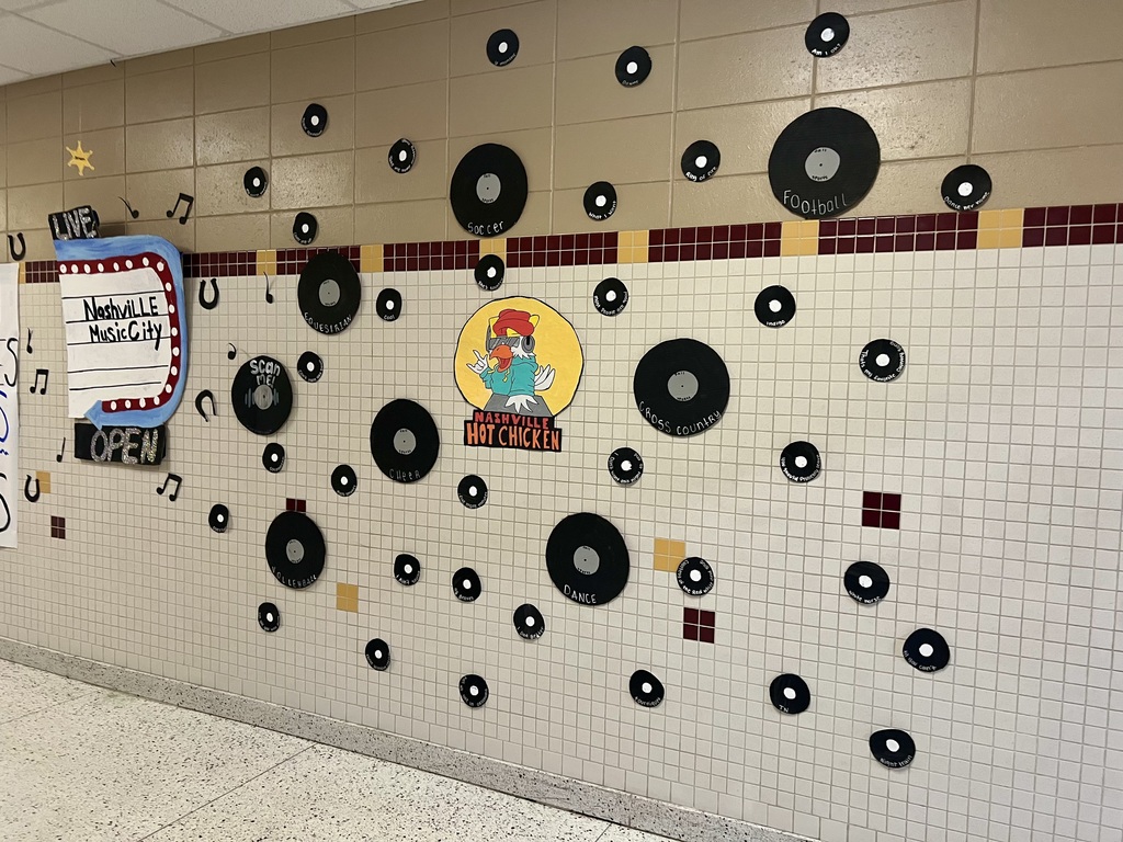 Picture of a hallway with paper records and a Nashville Hot Chicken logo.