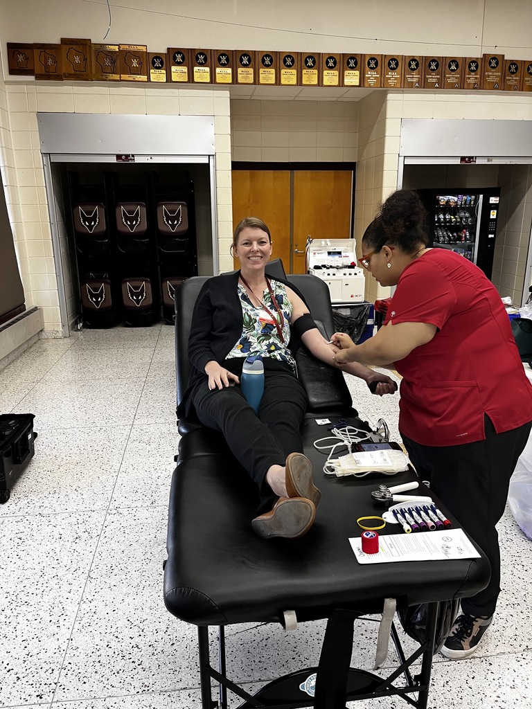 High school teacher giving blood.