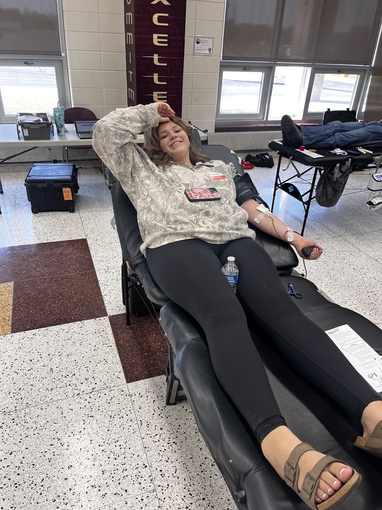High school student giving blood.