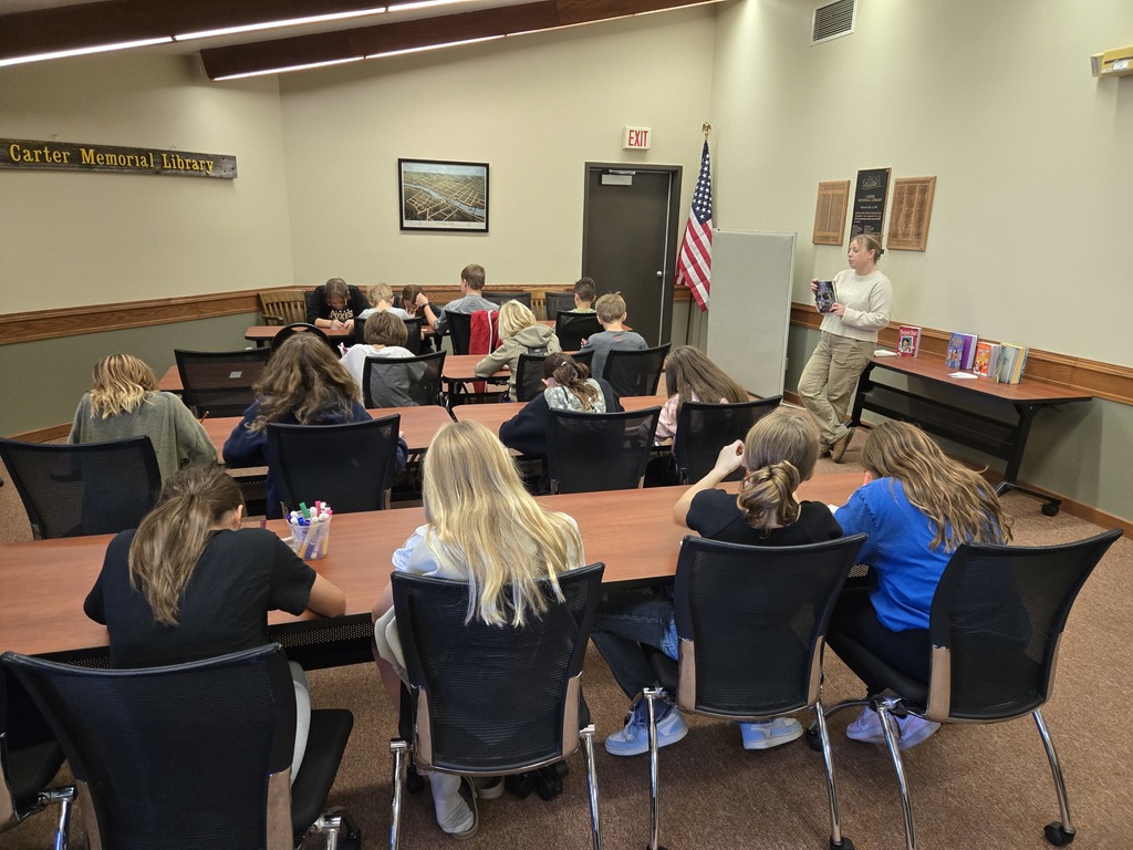 Middle school students learning about the programming at the public library. 