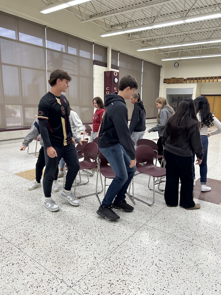 High school students playing musical chairs. 