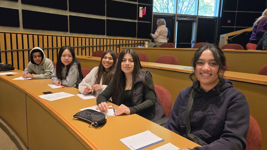 High school students sitting in a lecture hall.