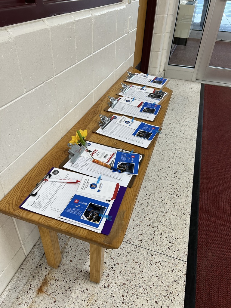 Clipboards on a table preparing for a Buckle Up campaign