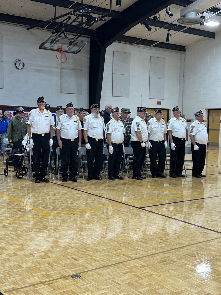 Veterans standing at a ceremony.