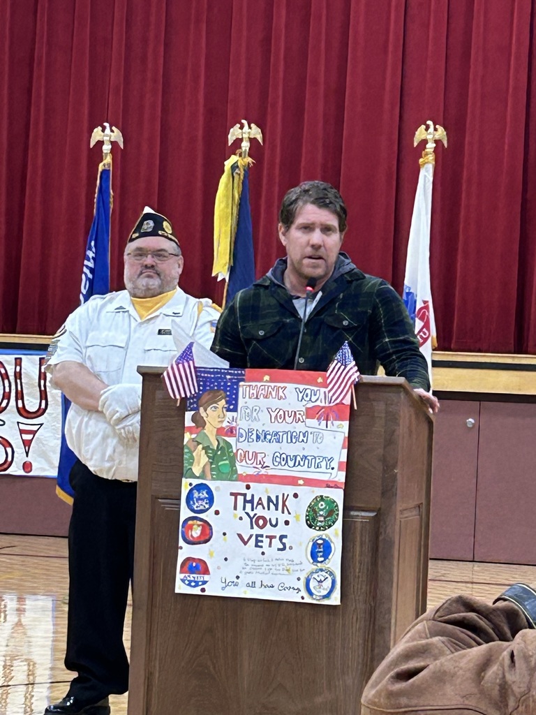 Two veterans at a podium.