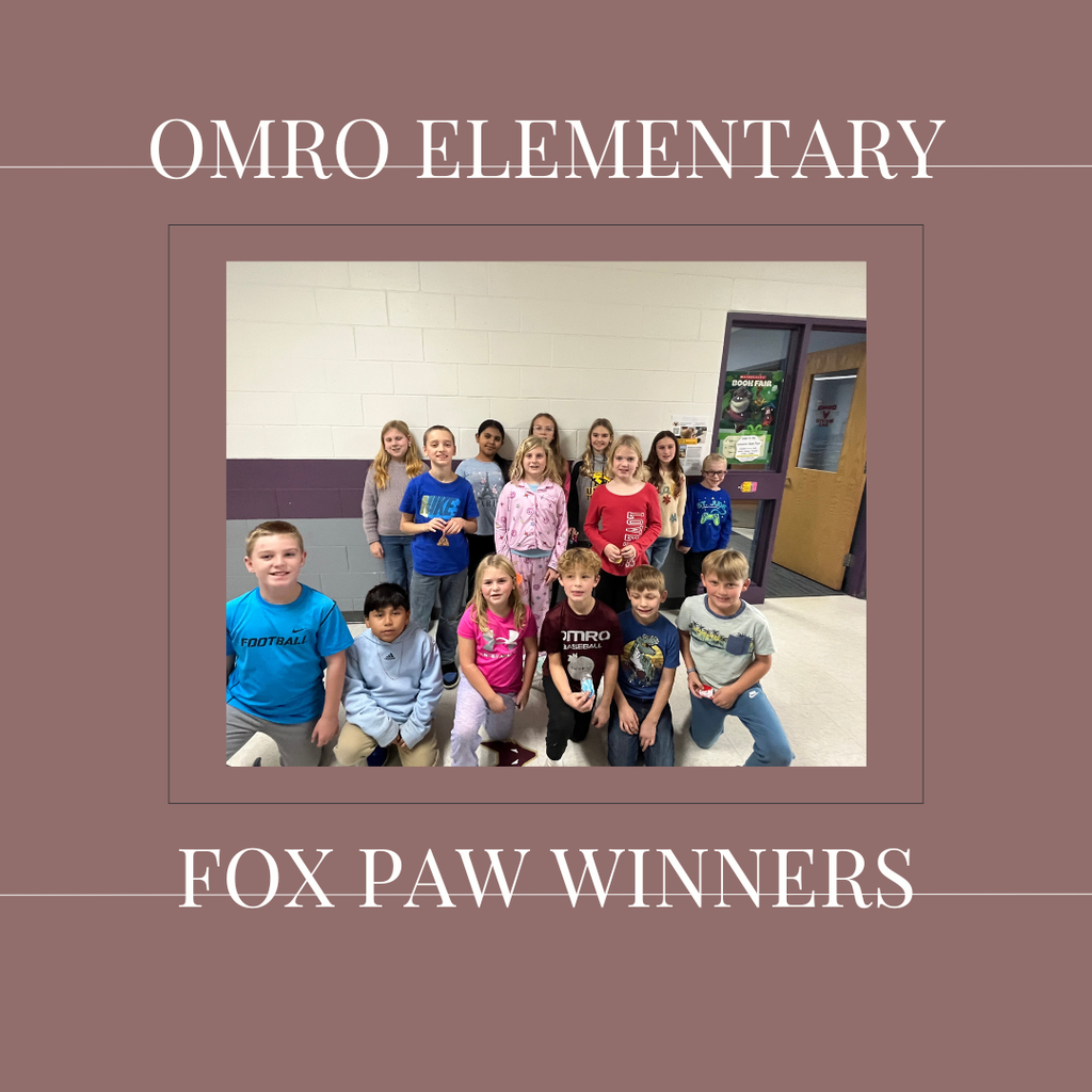 A group of elementary students in a hallway.