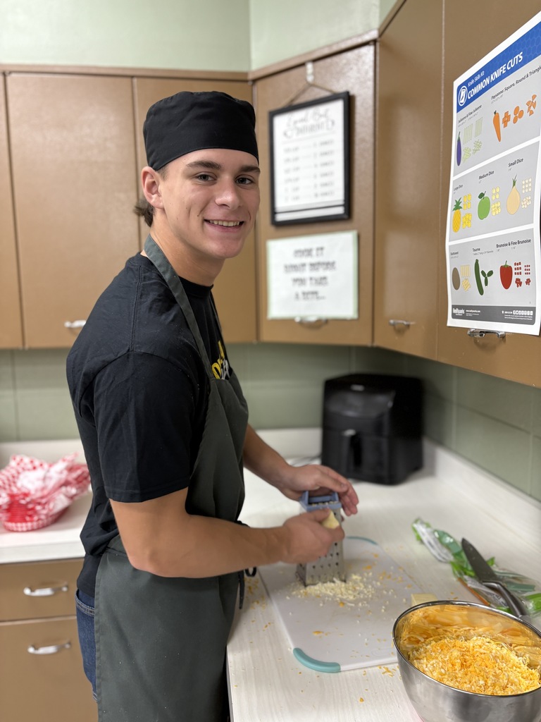 A high school student making macaroni and cheese.