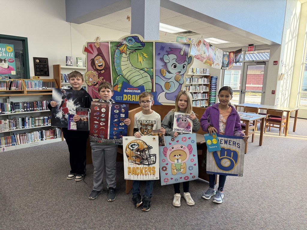 5 students are holding a poster and a book in front of them.