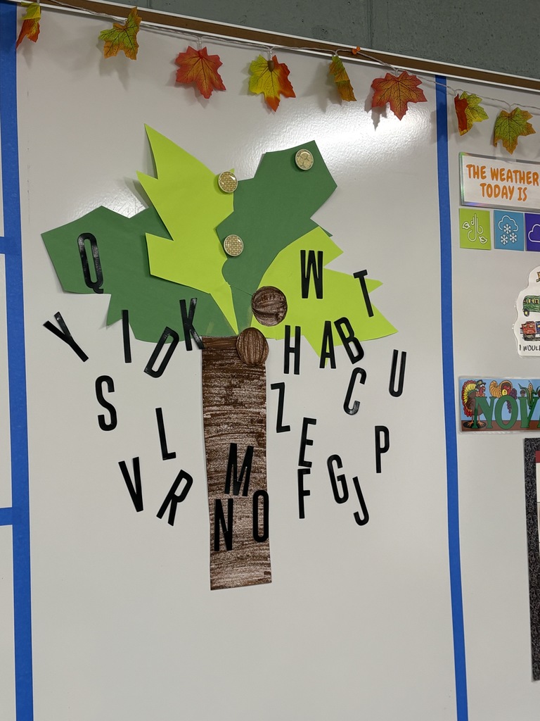 Poster made by high school students of a tree with letters falling off of it.