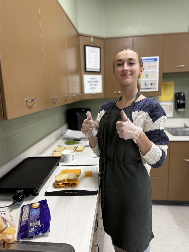 High school student preparing food.