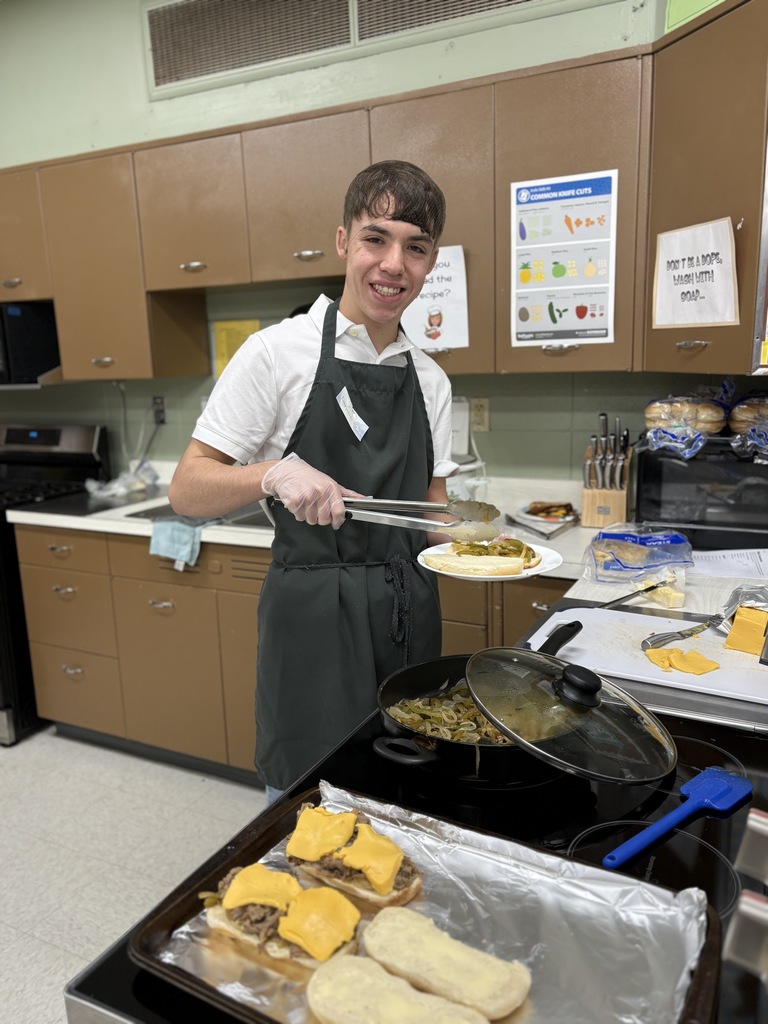 High school student preparing food.