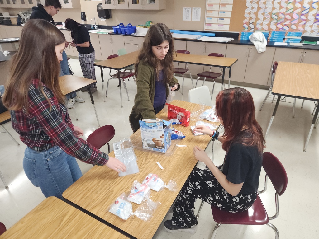 High school students preparing gift bags.