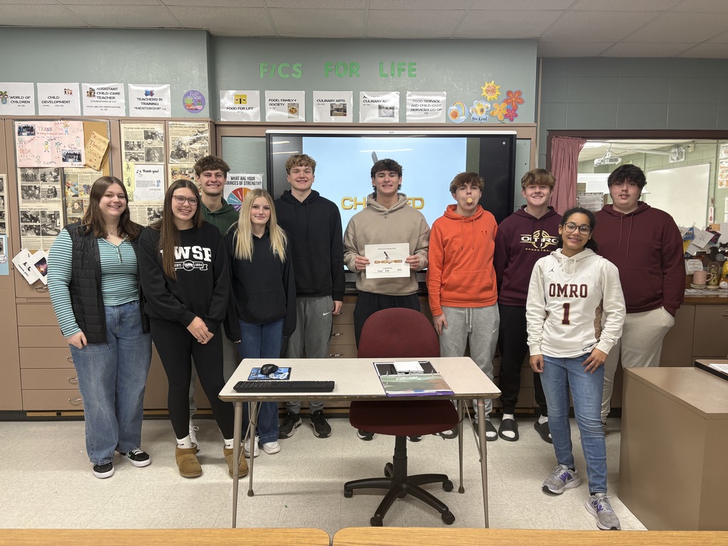 A group of high school students standing together.