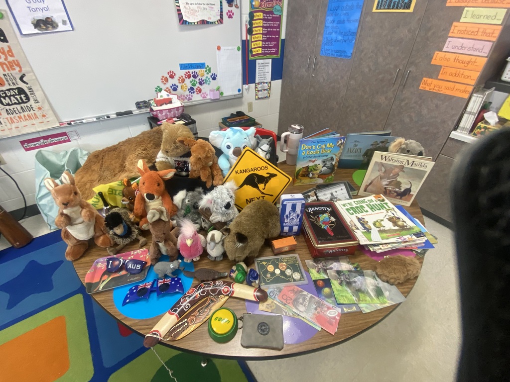 Books and artifacts, on a table, representative of Australia.