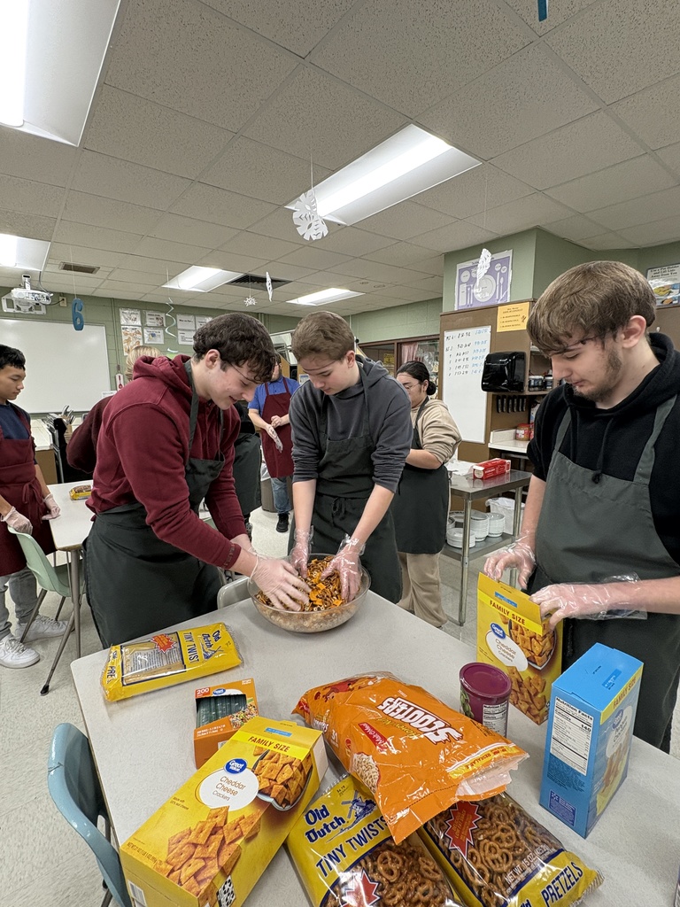 A class of high school students prepearing heart healthy snacks. 