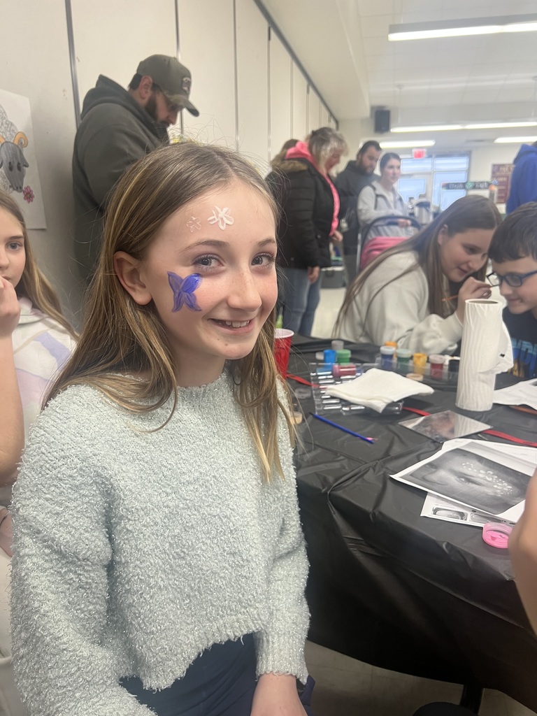 Elementary student with a face painting