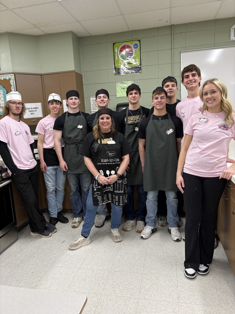 A group of high school students with their teacher.