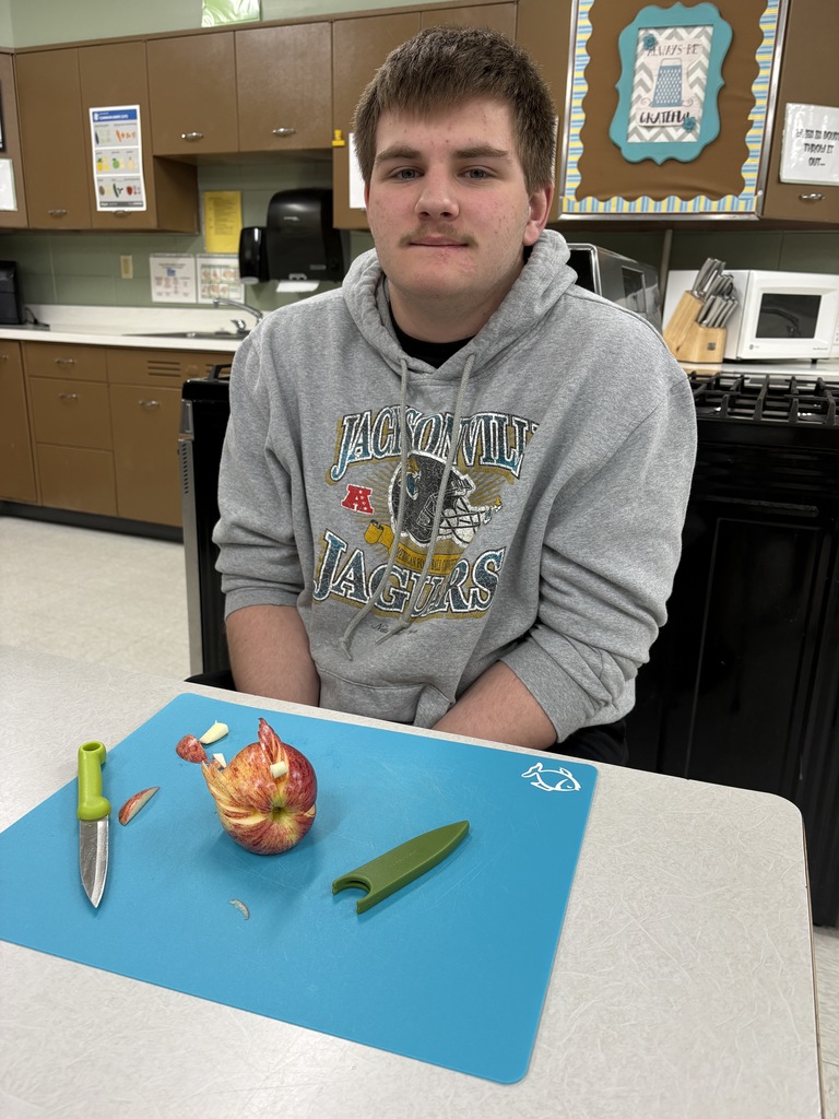 High school student showing off a bird garnish.