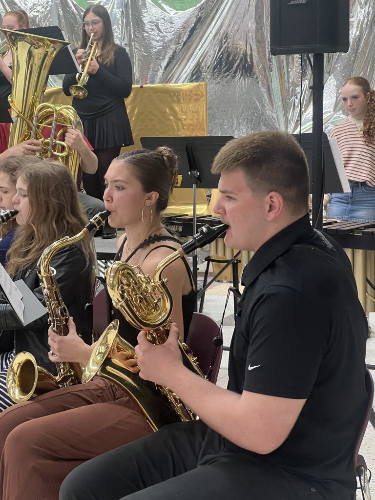 High school students playing the saxophone.