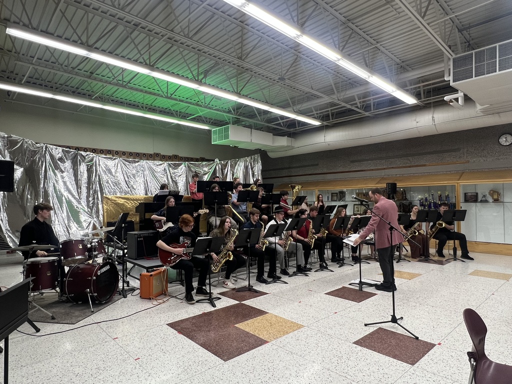 High school students playing instruments in a jazz band.