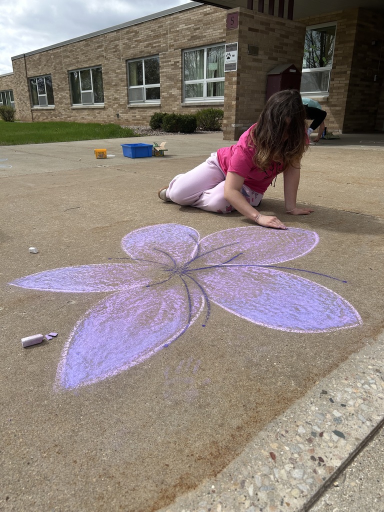 High school student doing sidewalk art. 