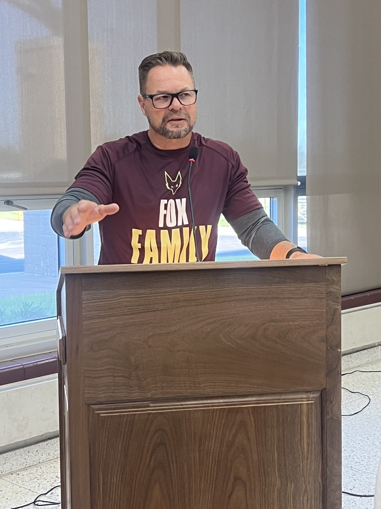 A male speaker at a podium.