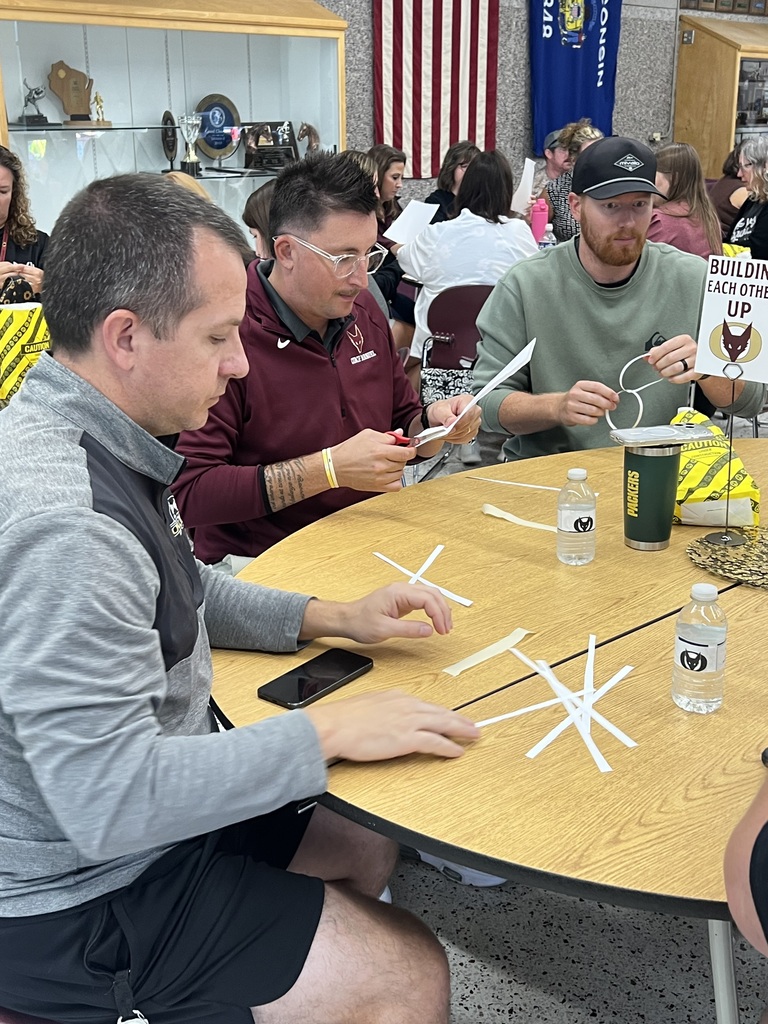 Adults working on a team building activity.