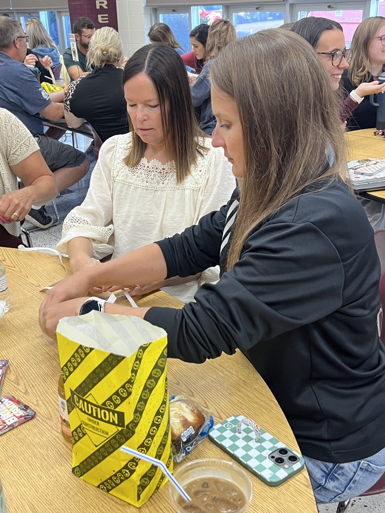 Adults working on a team building activity.