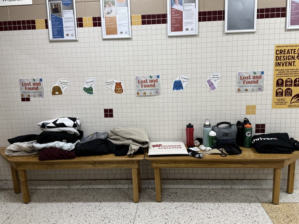 Clothing and other items sitting on a bench for a Lost and Found.