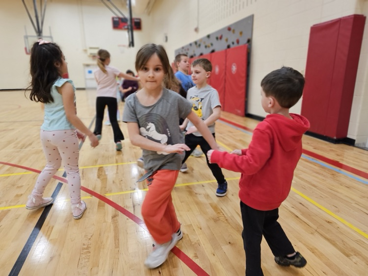 students square dancing in the gym