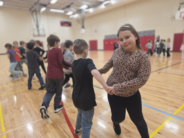 students square dancing in the gym