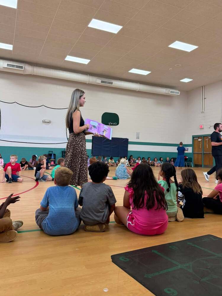 Ms. Reeves reading Say Something by Peter Reynolds to our students on Fun Friday