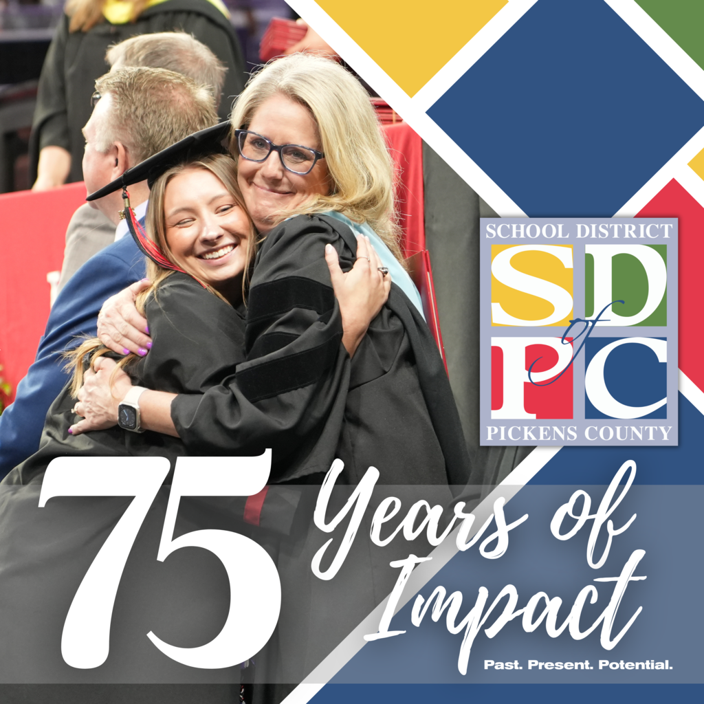 75 Years of Impact: Principal hugging student at graduate