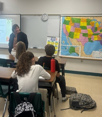 Mrs. Spitzmiller leading reading discussion