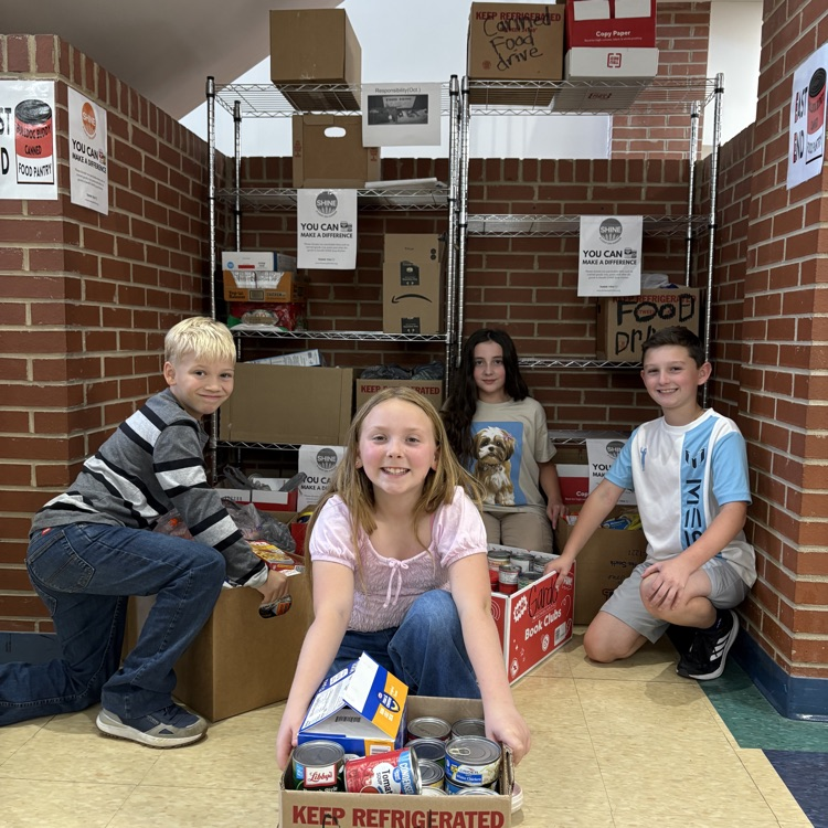 Our helpers collecting cans for the school food drive.
