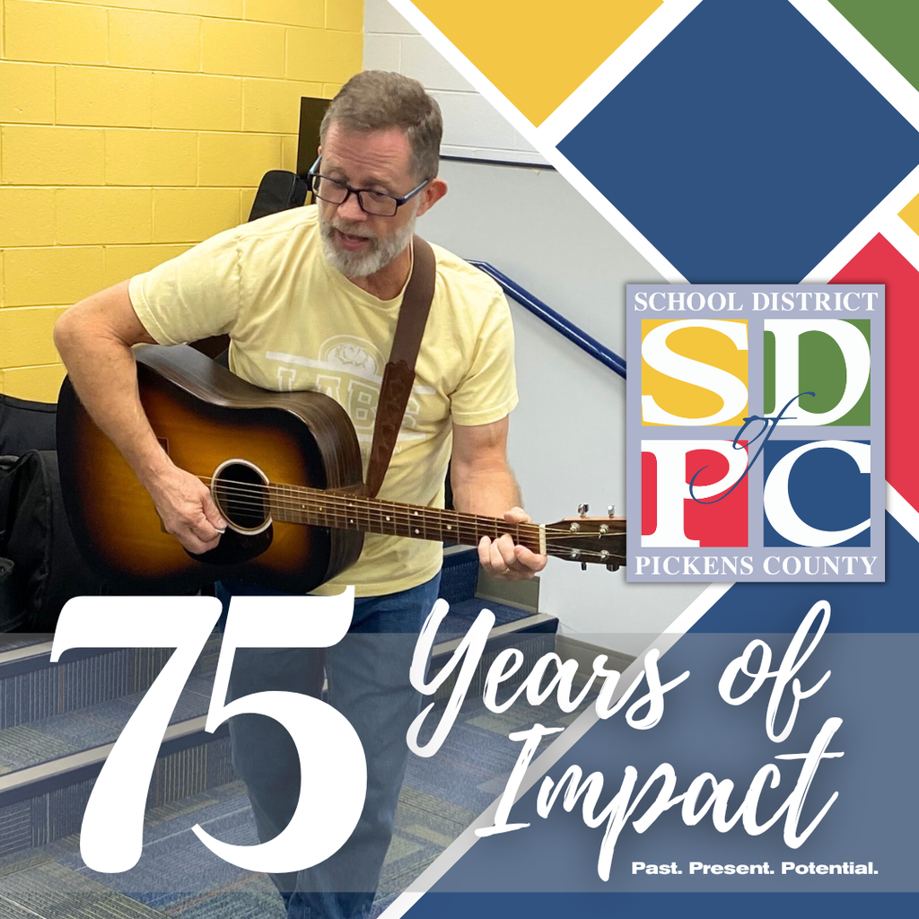 music teacher playing guitar