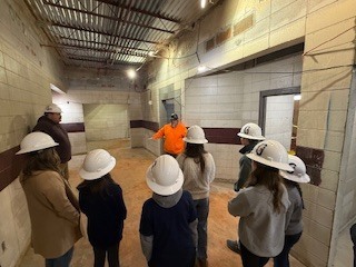 Triangle giving tour to students in G2i