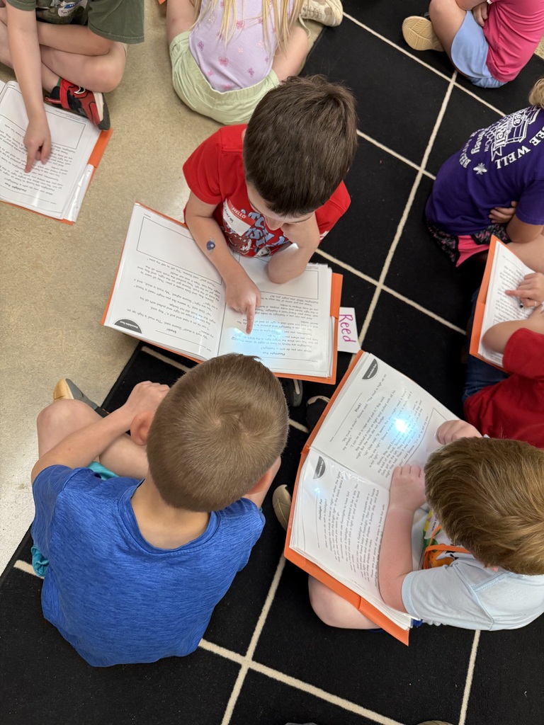 First graders reading with K5 buddies