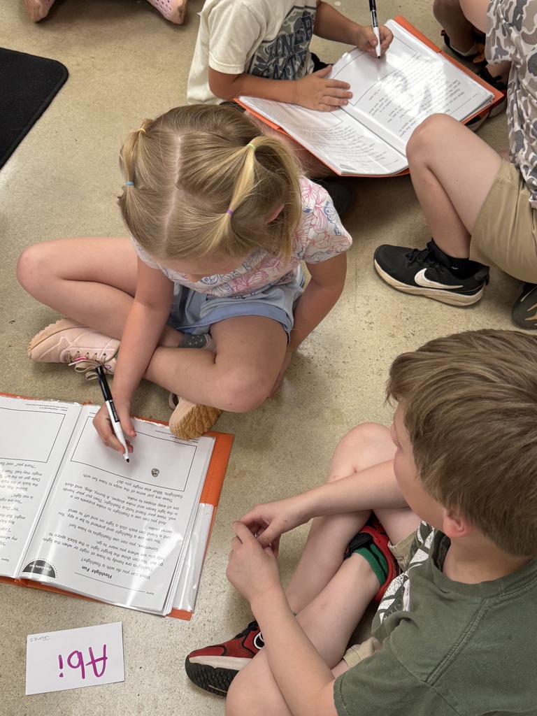 First graders reading with K5 buddies