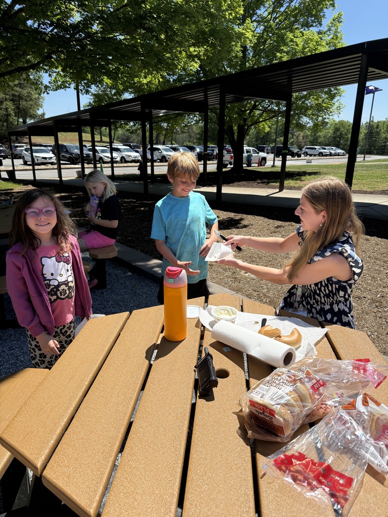 Second graders enjoying bagel activity