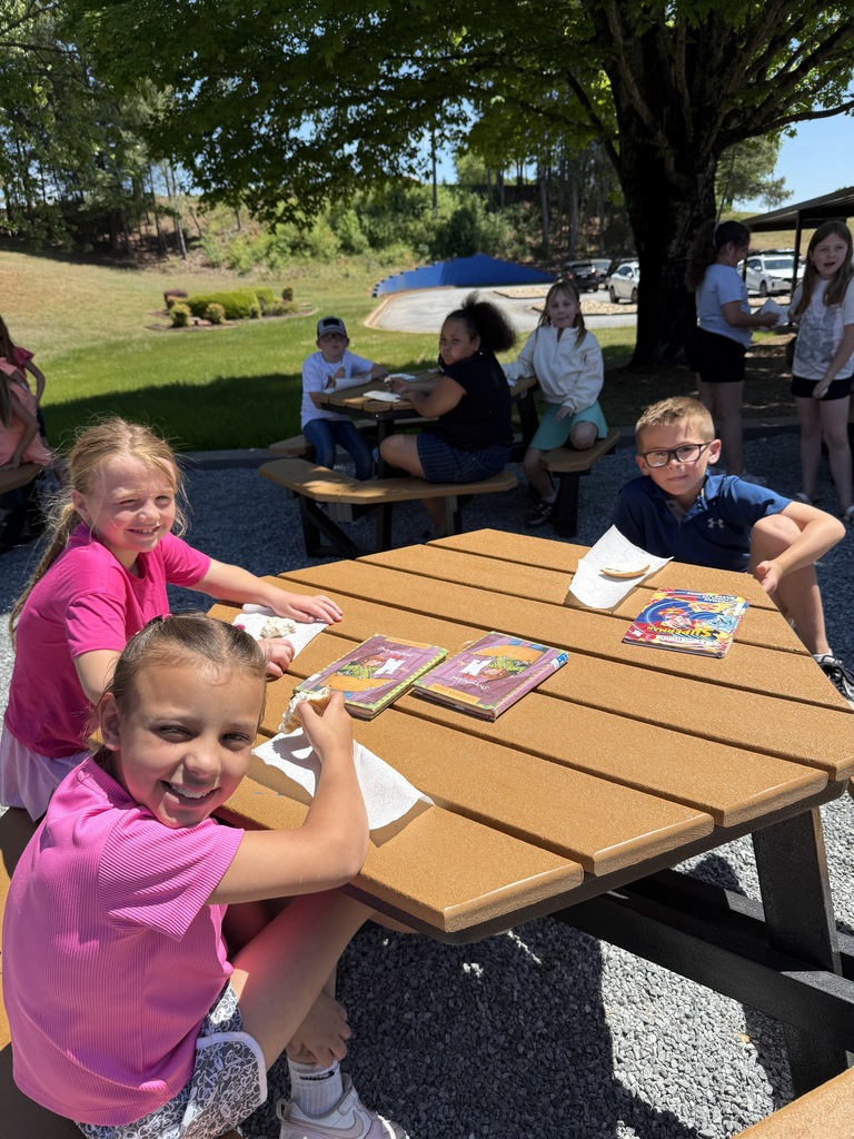 Second graders enjoying bagel activity