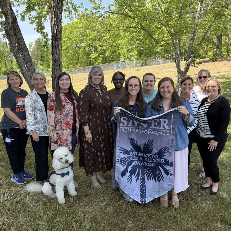 3rd–5th grade teachers from Hagood Elementary standing together, smiling and celebrating their school’s achievement