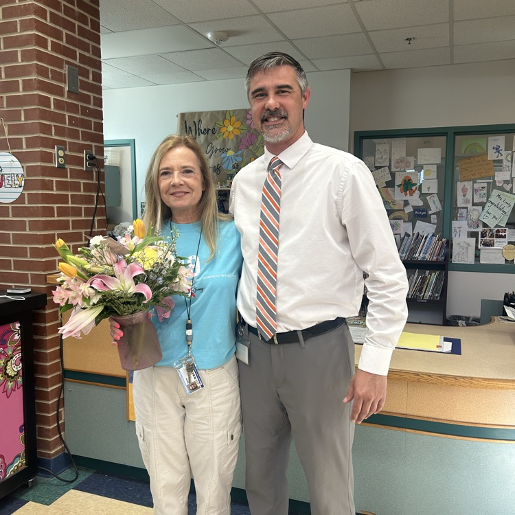 Mr. Brewington congratulating Mrs. McDowell