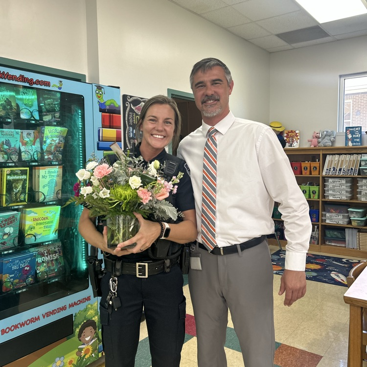 Mr. Brewington congratulating Officer OMalley