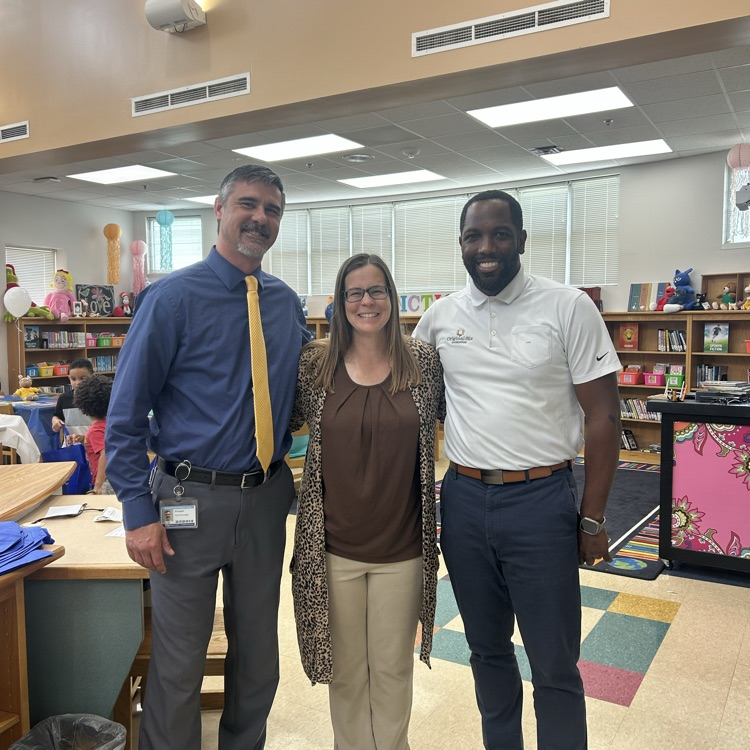 Mr. Brewington, Mrs. Spearman, and Mr. Washington celebrating My First Library